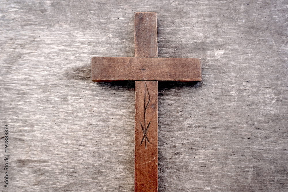 Wooden cross. Old wooden cross on an old wooden background 