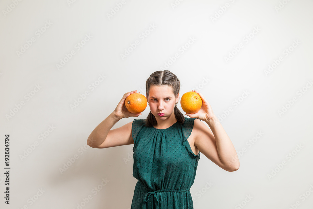 Serious bodybuilder poses with fruits in hands Serious bodybuilder poses with fruits in hands