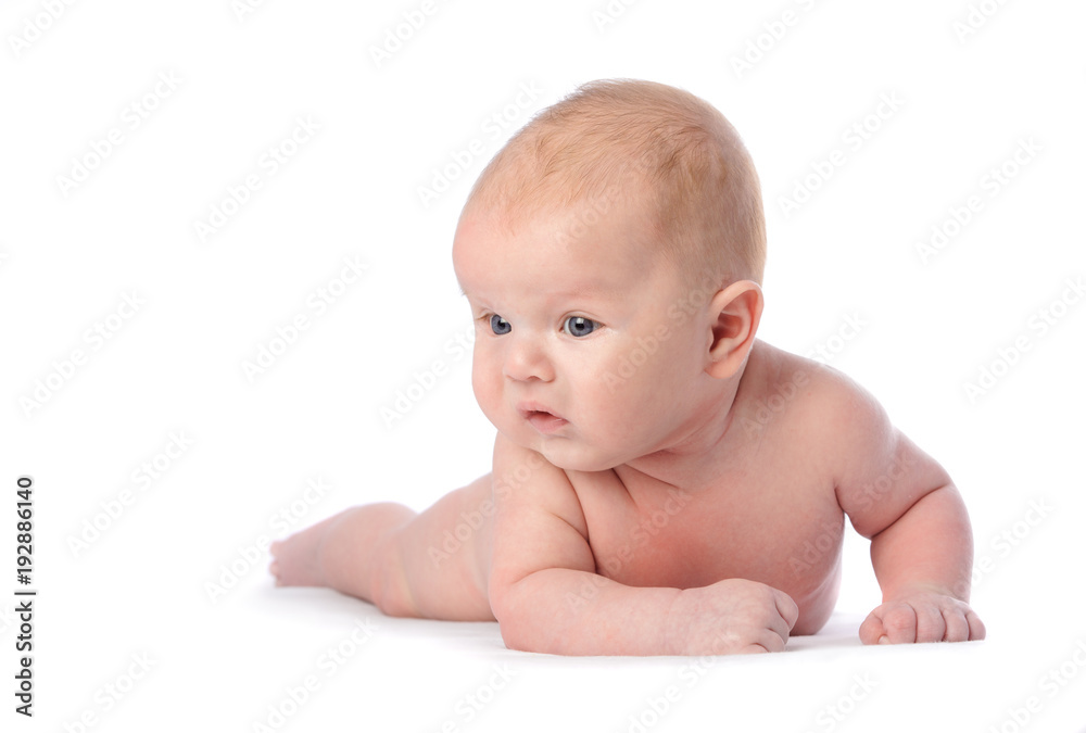 Baby with grey eyes lying and looking, isolated on white Baby with grey eyes lying and looking, isolated on white
