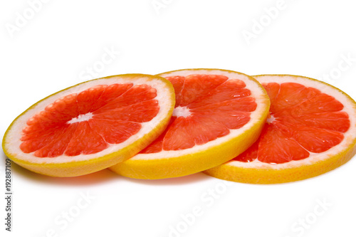 Grapefruit slices isolated on the white background photo
