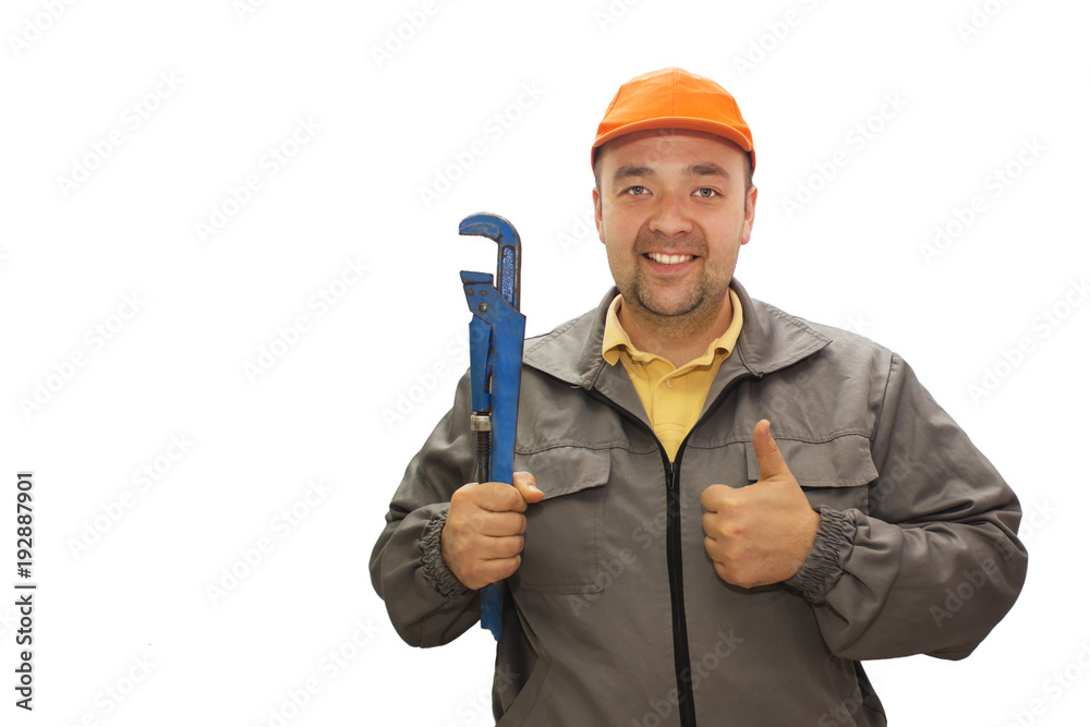 Young handsome plumber worker with adjustable wrench. Isolated over white background.
