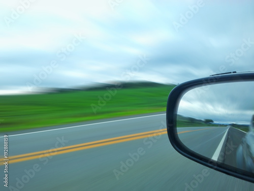 Speed highway on the outside mirror of the car