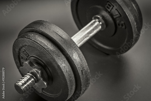 exercise concept - iron dumbbell abstract