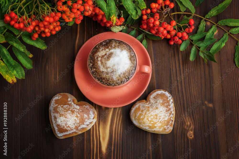Cup of coffee with Ginger cookies on wooden table. Gingerbread heart-shaped.