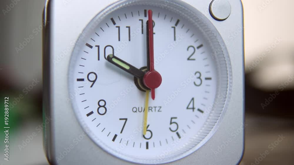 Quartz clock inside home ticks down to ten o' clock. Close up. Quartz clock inside home ticks down to ten o' clock. Close up.