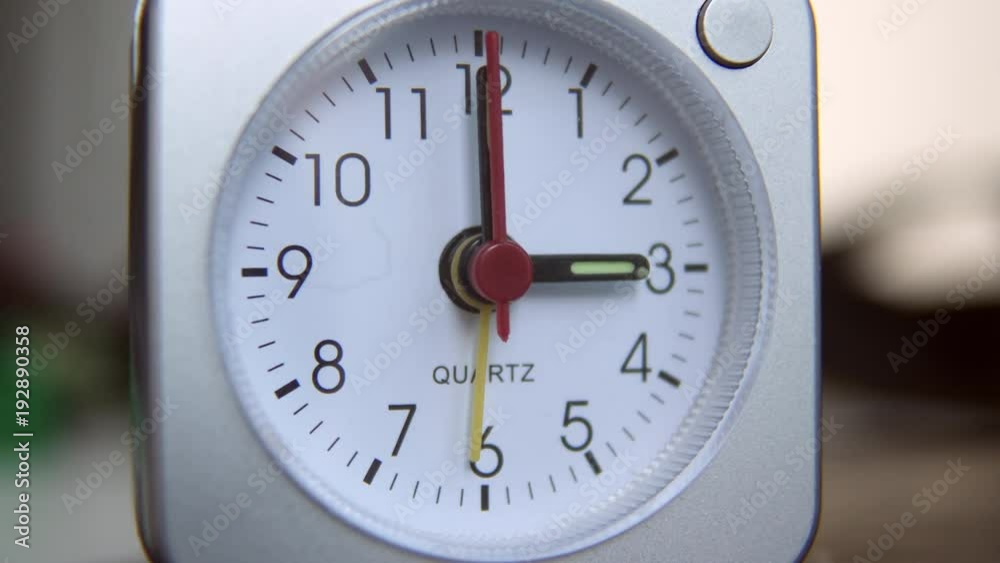 Quartz clock inside home ticks down to three o' clock. Close up. Quartz clock inside home ticks down to three o' clock. Close up.