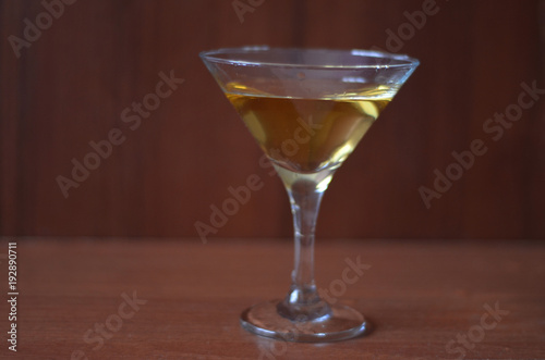 Martini cocktail on dark stone table. With space for your text