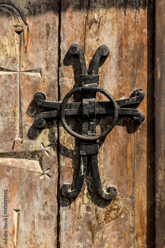 A fragment of an old wooden door in the monastery A fragment of an old wooden door in the monastery