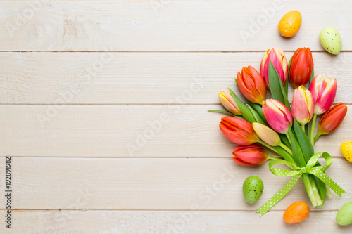 Spring easter tulips in bucket on white vintage background.