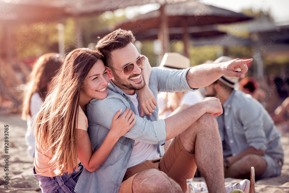 Romantic young couple on the beach,enjoying together. Romantic young couple on the beach,enjoying together.