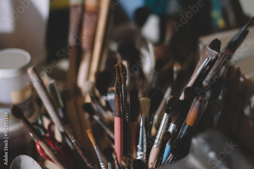 Paintbrushes together in a cup