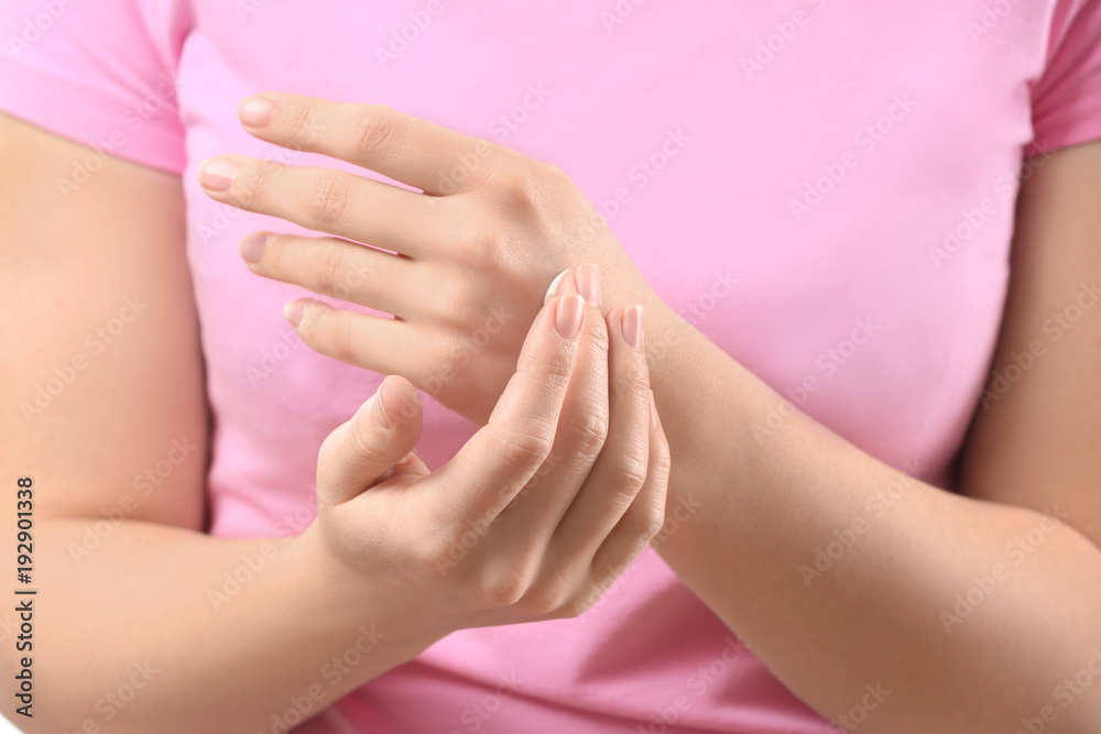 Fototapeta premium Woman applying body cream onto skin, closeup