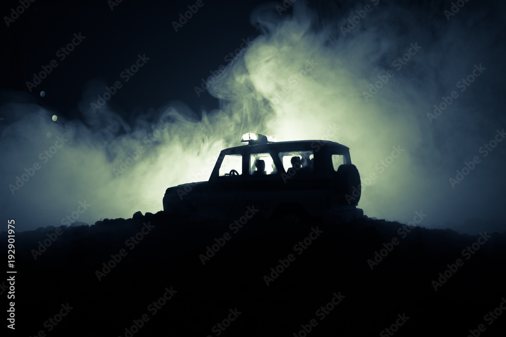 Anti-riot police give signal to be ready. Government power concept. Police in action. Smoke on a dark background with lights. Blue red flashing sirens. Anti-riot police give signal to be ready. Government power concept. Police in action. Smoke on a dark background with lights. Blue red flashing sirens.