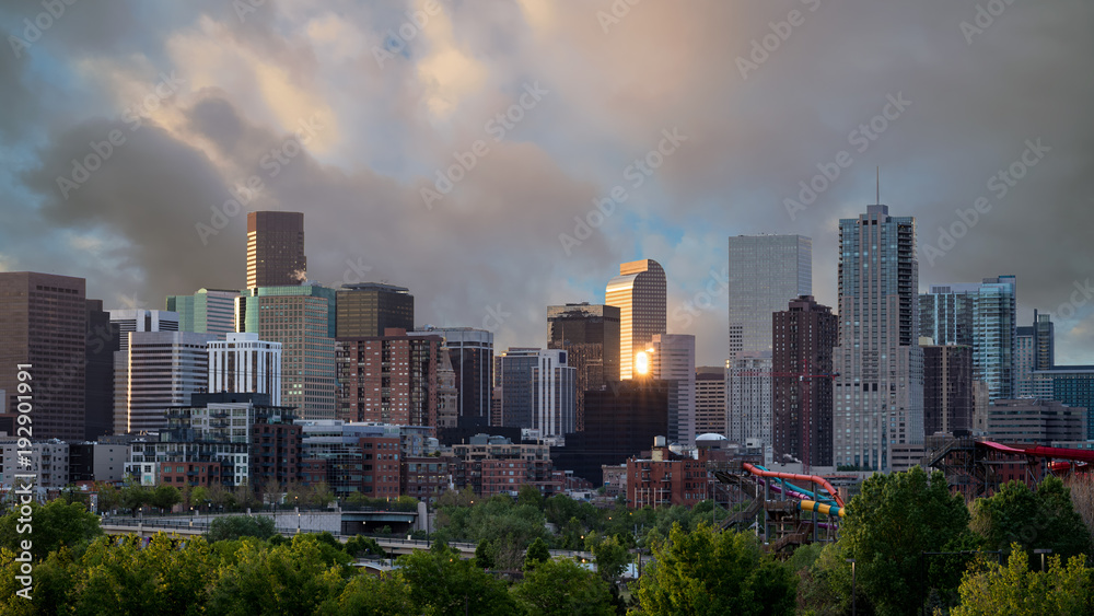 Close of the Denver Colorado skyline with morning clouds in the sky