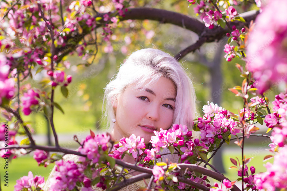 Gorgeous Kazakh lady and blossoming tree Gorgeous Kazakh lady and blossoming tree