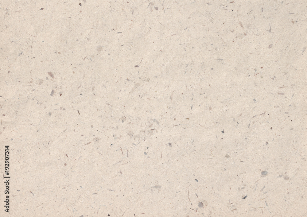 texture of kraft paper sheet with dark brown grain shavings texture of kraft paper sheet with dark brown grain shavings