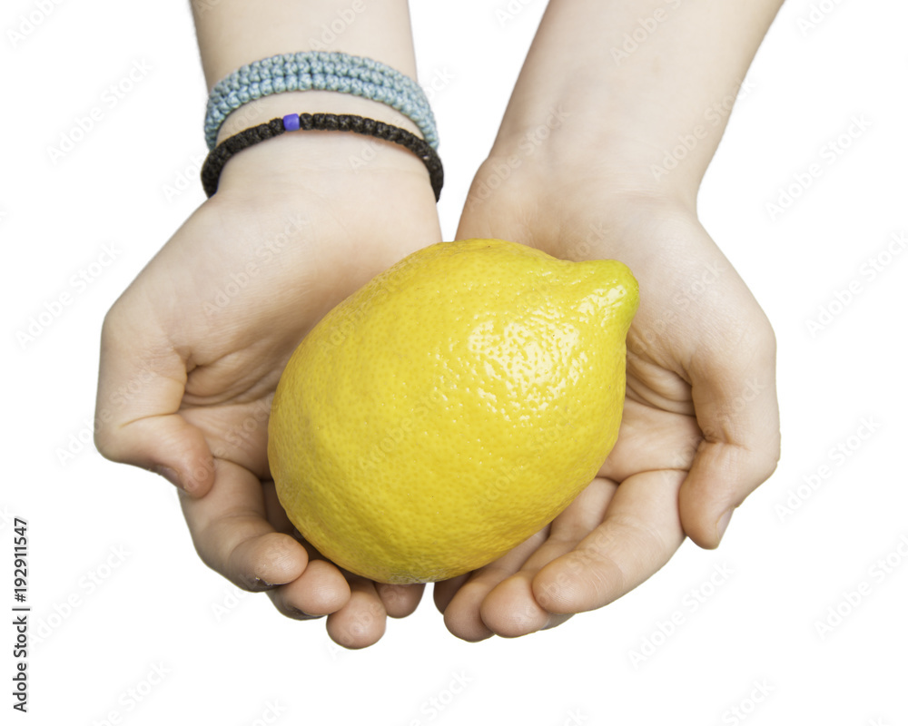 Close up of child hands holding a lemon isolated on white with clipping path at ALL sizes. Close up of child hands holding a lemon isolated on white with clipping path at ALL sizes.