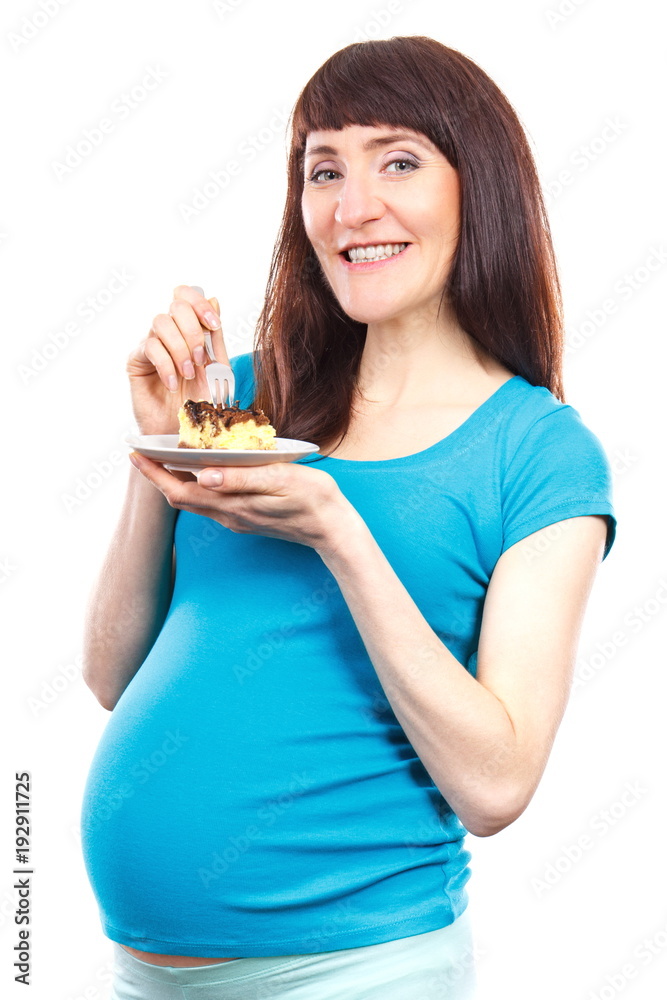 Woman in pregnant eating fresh cheesecake, concept of nutrition during pregnancy Woman in pregnant eating fresh cheesecake, concept of nutrition during pregnancy