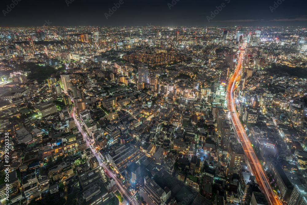 Φωτογραφία Tokyo - August 08, 2017 : Night aerial view of Tokyo skyline and highway car trails on Route 3 (Shuto Expressway) Shibuya Route from Roppongi Hills Mori Tower