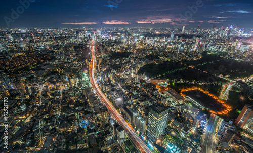Tokyo - August 08  2017   Panoramic night aerial view of Tokyo skyline and highway car trails on Route 3  Shuto Expressway  Shibuya Route from Roppongi Hills Mori Tower.