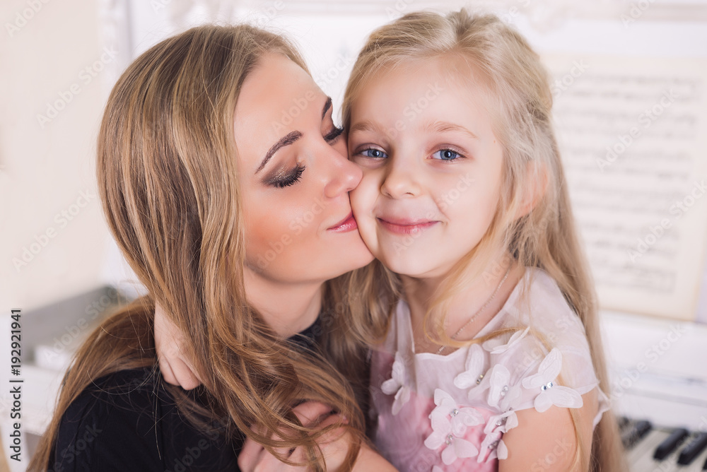 mother hug with daughter face to face close up mother hug with daughter face to face close up