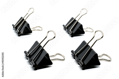 Binder clips on white backg...