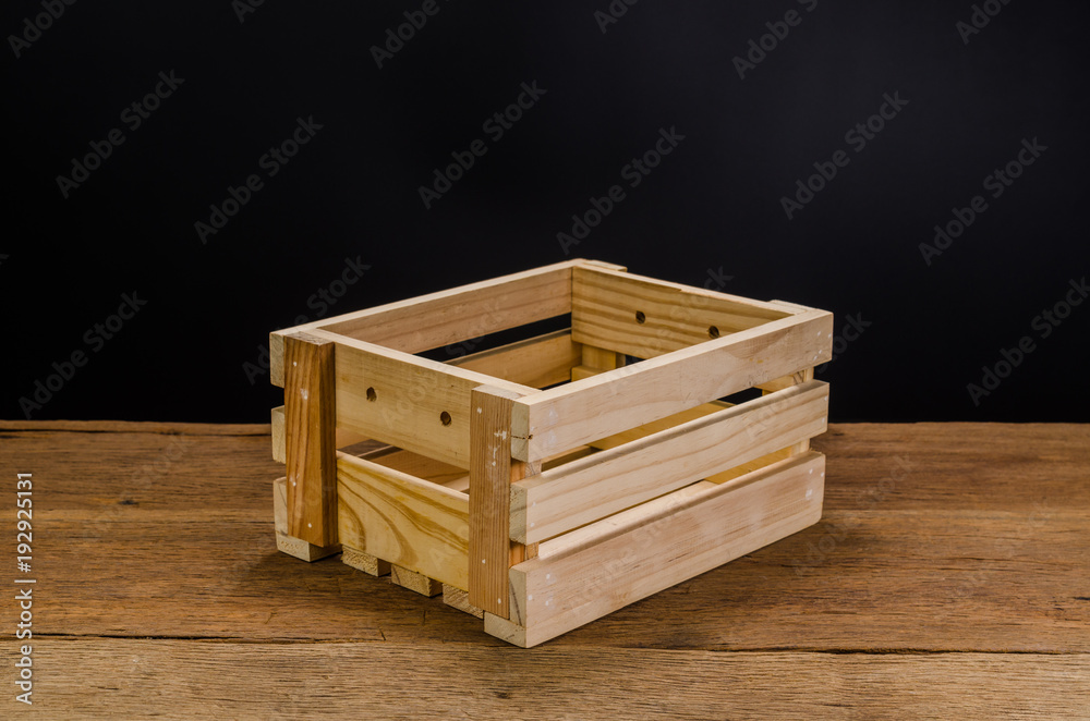 empty wooden crate on wooden board background