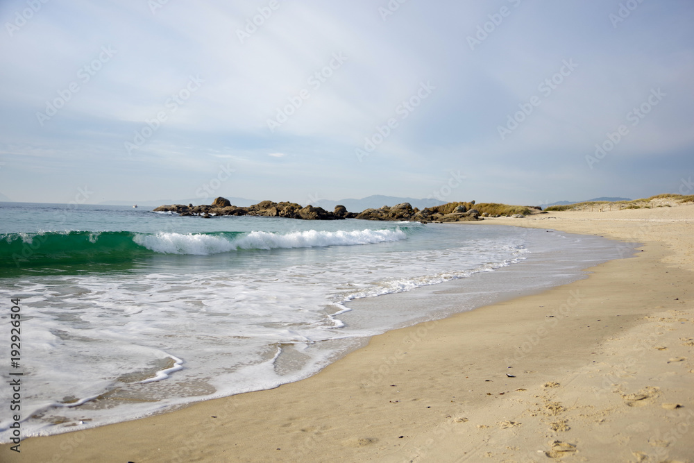 Waves on sandy beach Samil in Vigo, Vigo, Galicia, Spain Waves on sandy beach Samil in Vigo, Vigo, Galicia, Spain
