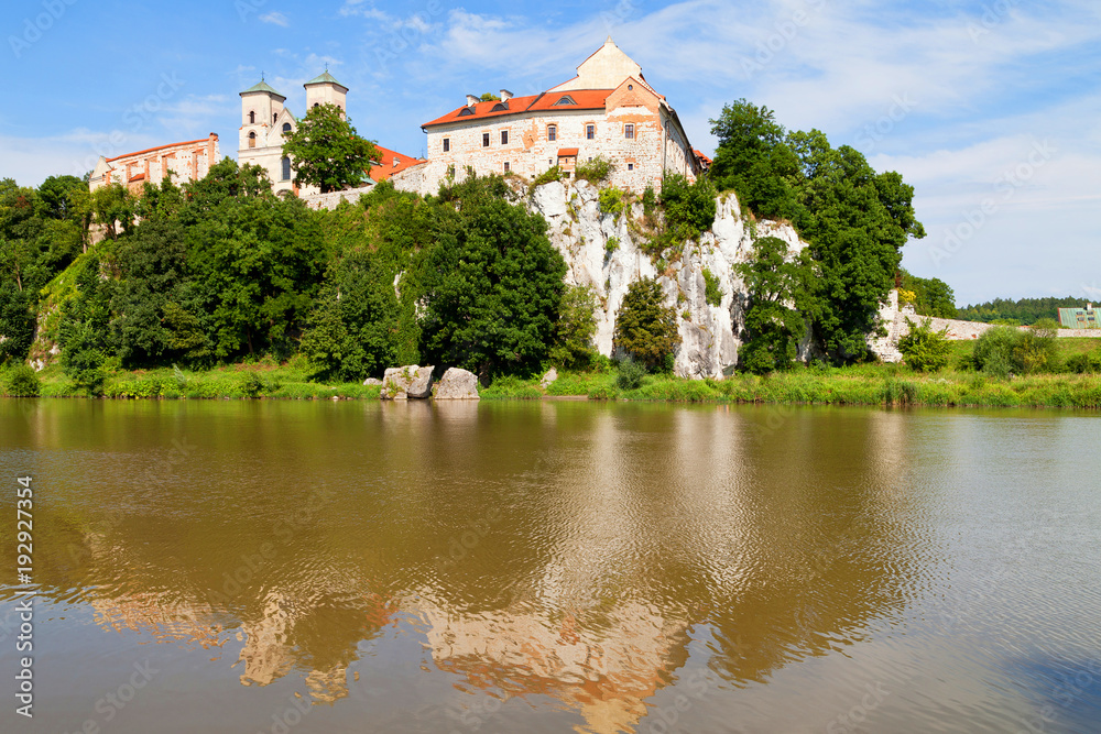 The Benedictine Abbey in Tyniec with wisla river on blue sky background