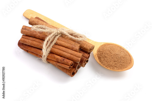 Fotótapéta Cinnamon sticks bunch with powder isolated on white background