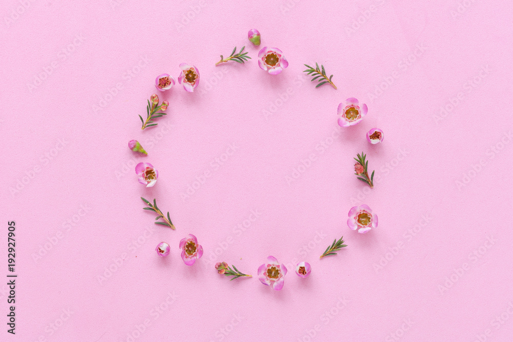 Pink background with flower circle ornament, top view