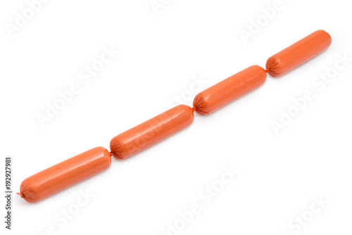 Photography Bundle of uncooked thin long wieners on a white background