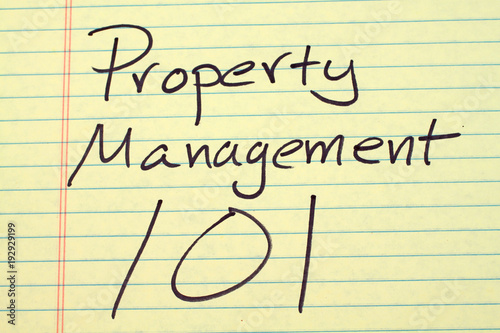The words Property Management 101 on a yellow legal pad