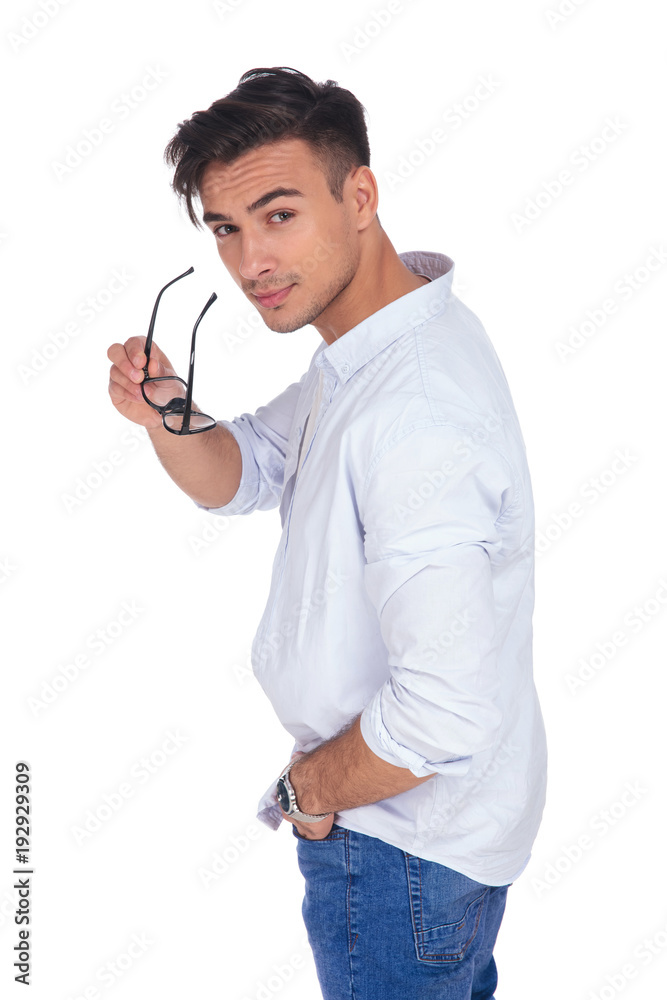 side view of a casual man taking off his glasses Stock Photo | Adobe Stock