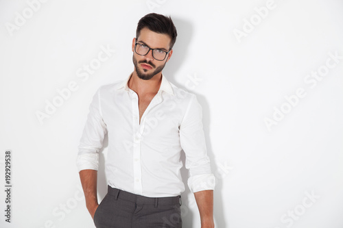 sexy young smart man standing with hand in pocket