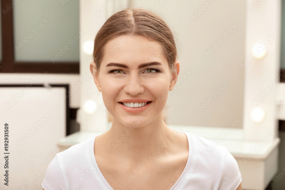 Young woman with beautiful eyebrows indoors Young woman with beautiful eyebrows indoors