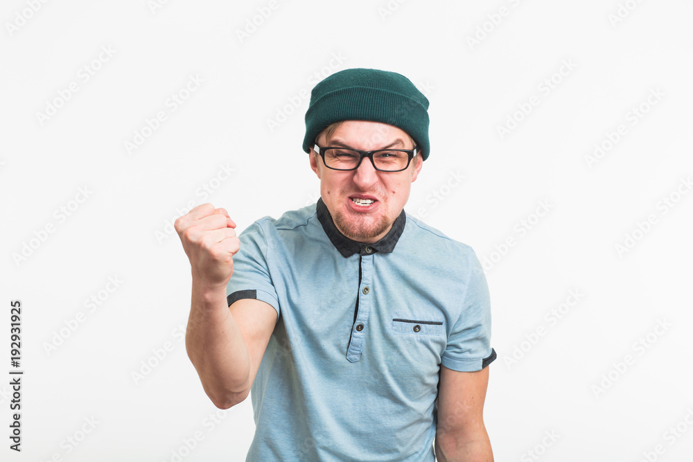 portrait of young angry man on white background portrait of young angry man on white background