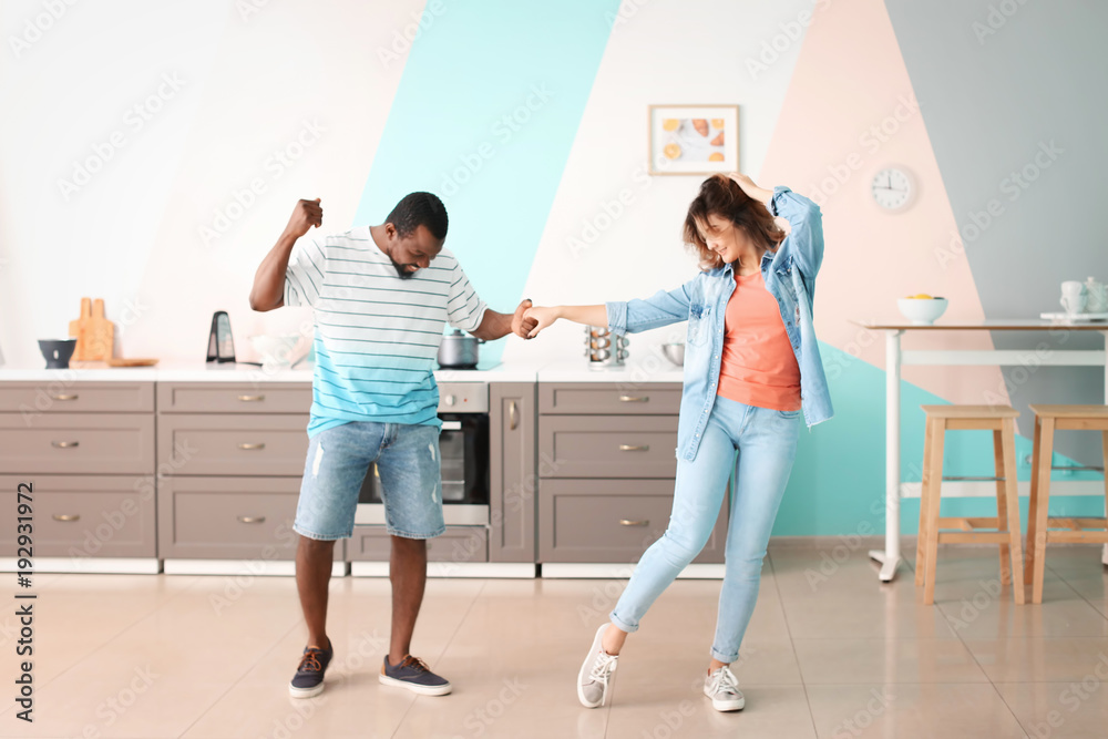 Cute interracial couple dancing at home Cute interracial couple dancing at home