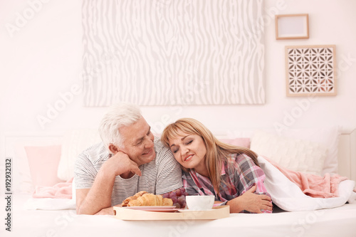 Mature couple having breakf...