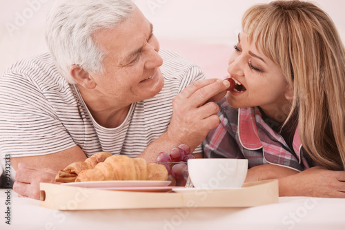 Mature couple having breakf...