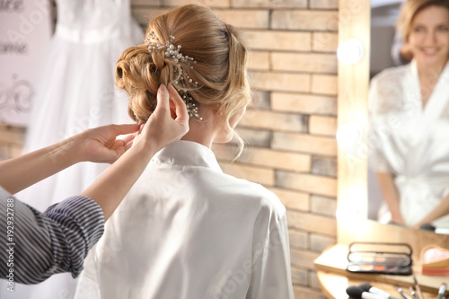 Hairdresser preparing bride...
