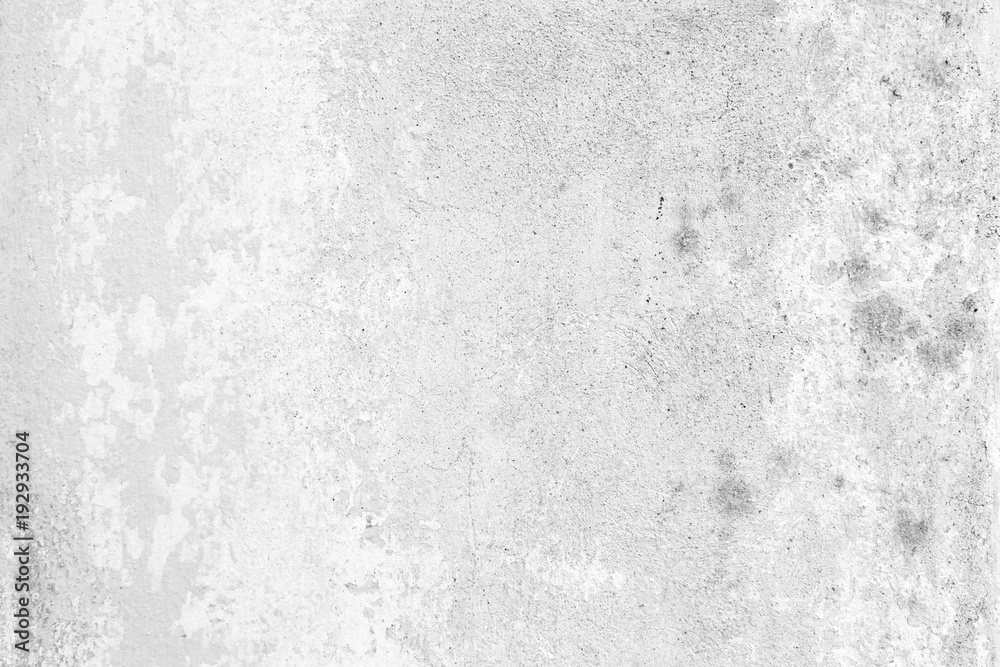 Weathered and aged concrete wall with paint mostly peeled off in black and white. Weathered and aged concrete wall with paint mostly peeled off in black and white.