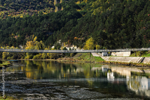 Beautiful colorful autumnal scenic/ bridge over the river