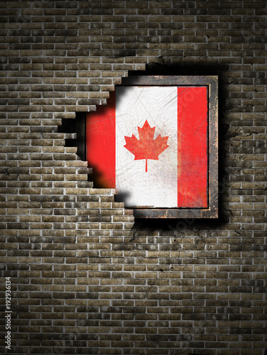 Old Canada flag in brick wall photo