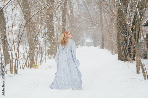 Beautiful girl  under the snowfall