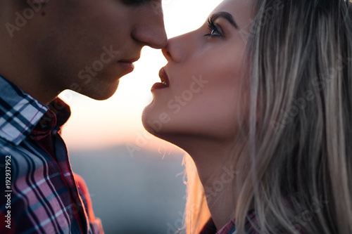 The lovely couple in love looking at each other