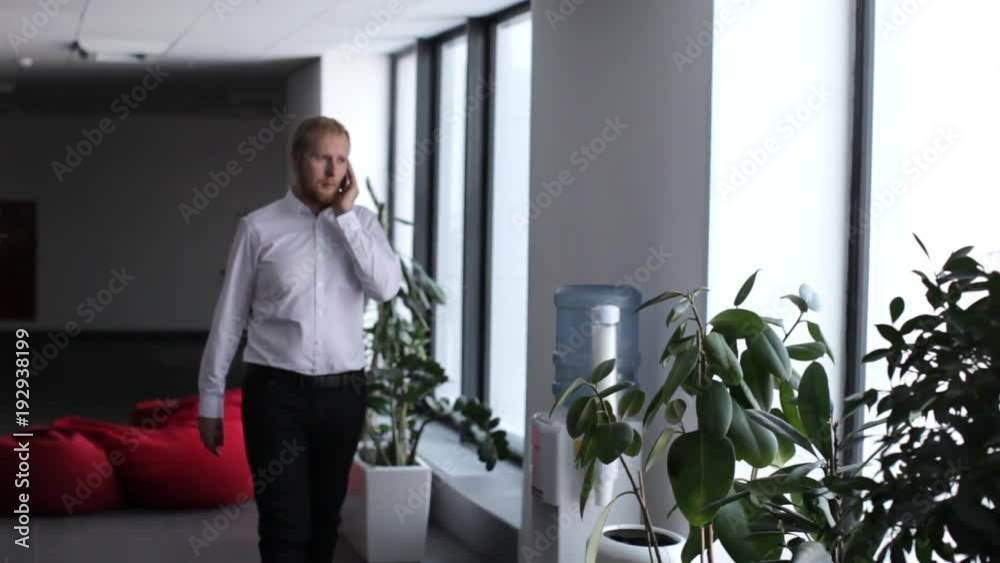 business man talking on the phone in the office business man talking on the phone in the office