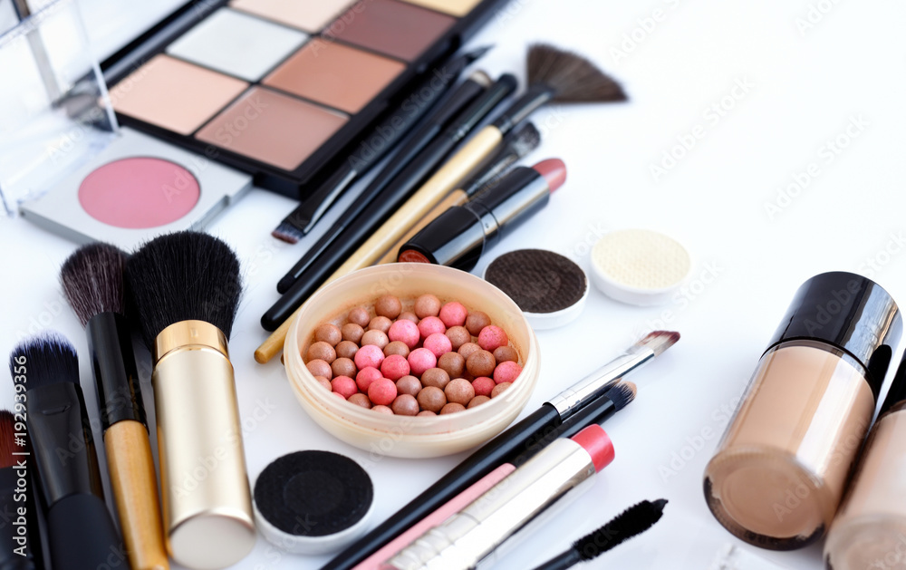 Makeup brush and decorative cosmetics on a white background Makeup brush and decorative cosmetics on a white background