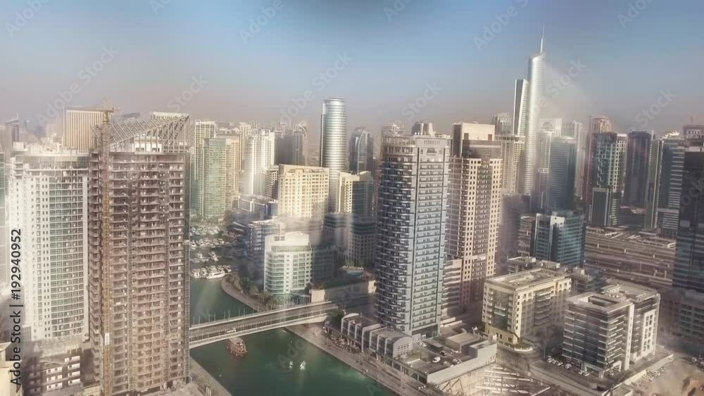 Dubai Marina skyscrapers aerial view with light rays coming from the sky Dubai Marina skyscrapers aerial view with light rays coming from the sky