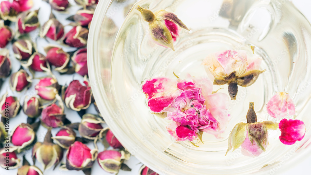 A cup of tea pink rose on a white background. A cup of tea pink rose on a white background.